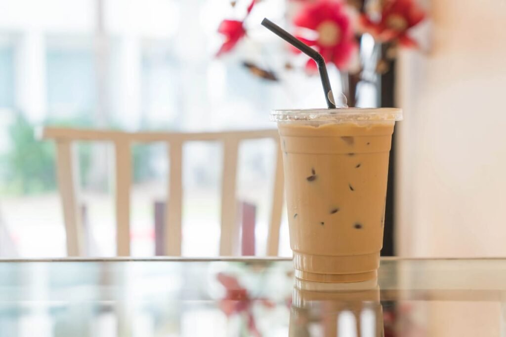 Top Iced Coffee Recipes and Tips to Stay Cool and Energized | ibobeans Iced coffee cup on a desk – iBoBeans