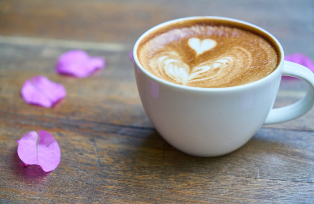 What Is White Coffee? Easy Recipe, Tips, and a Simple Guide for Beginners adobe express file 2 (2) White coffee cup with heart latte art symbolizing the health benefits and smooth taste of white coffee.(1)